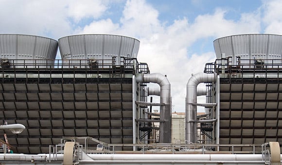 two cooling towers in an industrial facility